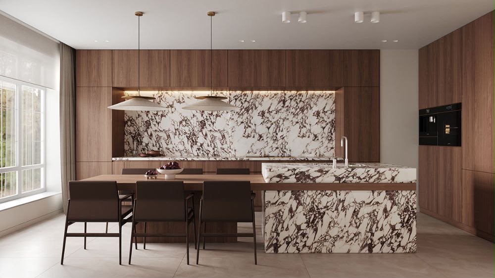 Cocina de diseño con isla de mármol veteado, madera oscura y mesa integrada — showroom A.MODO